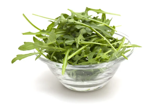 Fresh rucola leafs in a glass bowl — Stock Photo, Image