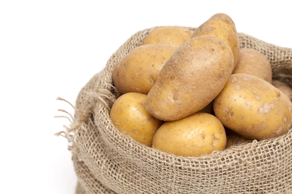 Pommes de terre dans un sac en toile de jute — Photo