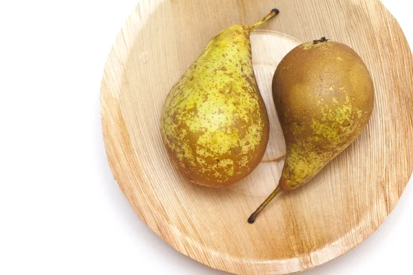 stock image Pears on palm leaf plate