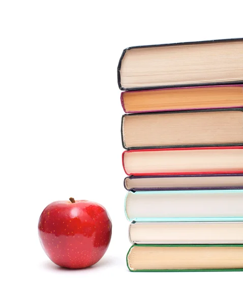 Manzana y pila de libros — Foto de Stock