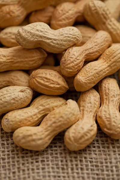 Peanuts on burlap — Stock Photo, Image
