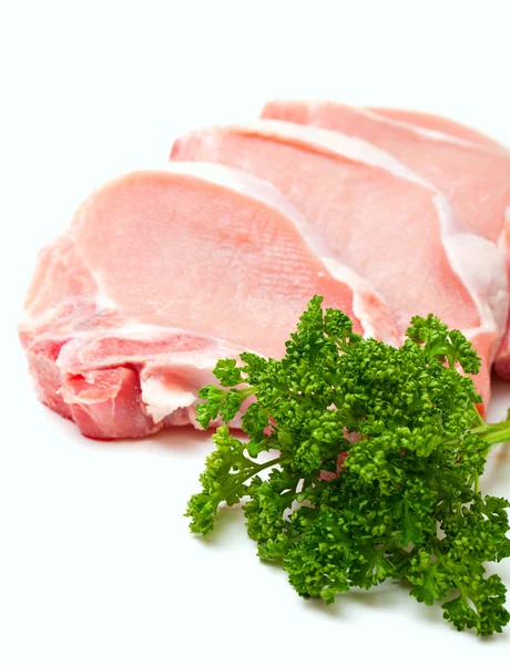 Darab hús és csomó petrezselyemzöld elszigetelt fehér background — Stock Fotó
