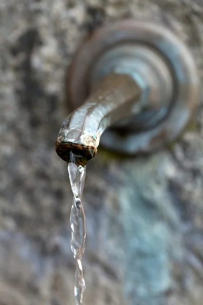 stock image Closeup of water running from outdoor wall faucet