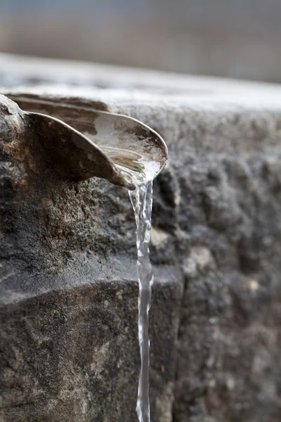 stock image Closeup of water running from outdoor wall faucet