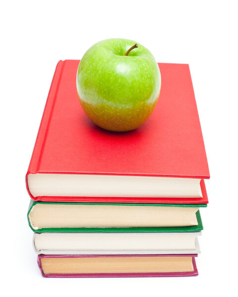 Apple on stack of books