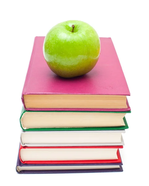 Apple on stack of books — Stock Photo, Image