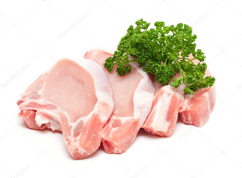 Pieces of meat and bunch of parsley isolated on white background