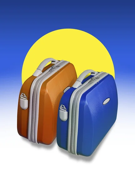 Two bright colored suitcases and sun
