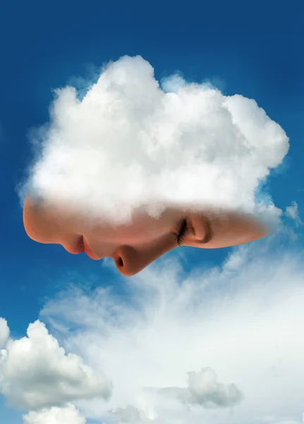 Vrouw gezicht in een wolk — Stockfoto