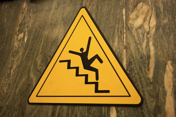 Обережно на сходах — стокове фото