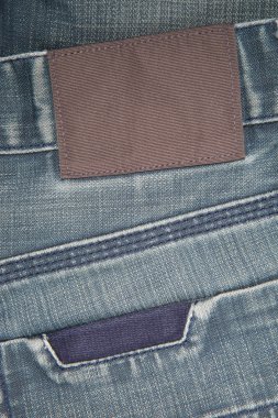 Empty leather label on a blue jeans clipart