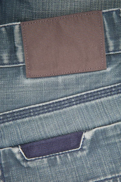 空皮革标签上蓝色牛仔裤 — 图库照片