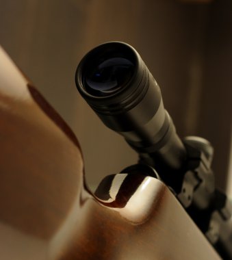 Scope mounted on a rifle clipart