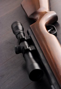 Scope mounted on a rifle clipart