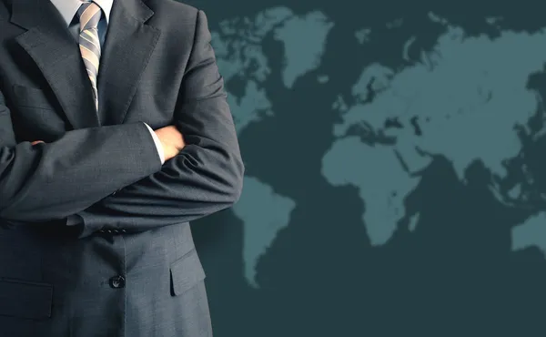 stock image Businessman in front of world map