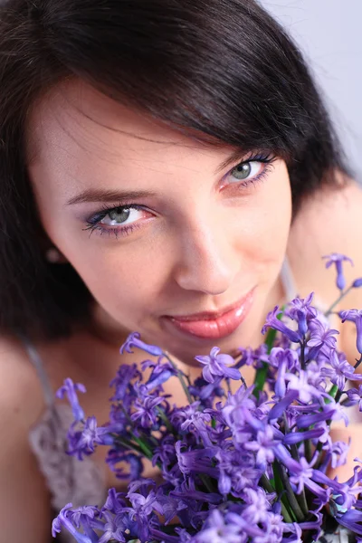 Young woman with purple hyacinth — Stock Photo, Image