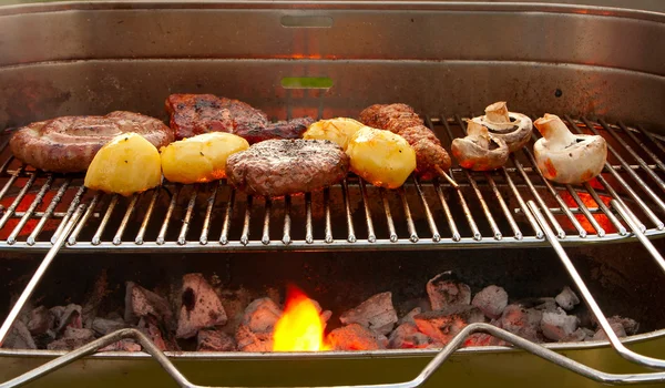 Barbecue with meat and vegetables — Stock Photo, Image