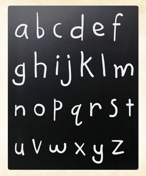 Complete english alphabet handwritten with white chalk on a blac — Stock Photo, Image