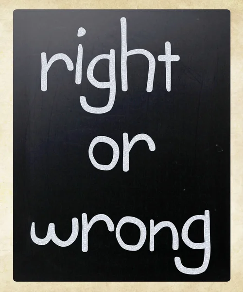 "Right or wrong" handwritten with white chalk on a blackboard — Stock Photo, Image