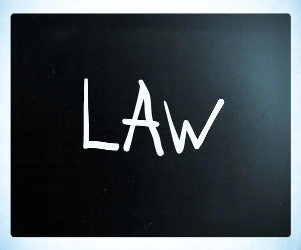 "Law" handwritten with white chalk on a blackboard — Stock Photo, Image