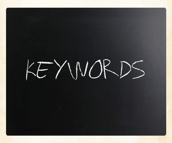 The word "Keywords" handwritten with white chalk on a blackboard — Stock Photo, Image