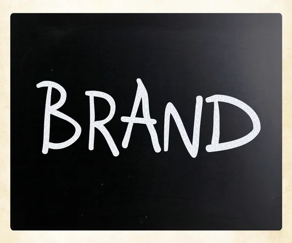 "Varumärket ”handskrivna med vit krita på en svart tavla — Stockfoto