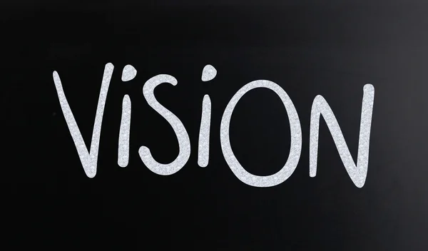 The word "Vision" handwritten with white chalk on a blackboard — Stock Photo, Image