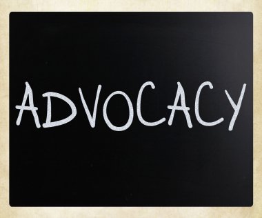 The word 'Advocacy' handwritten with white chalk on a blackboard clipart