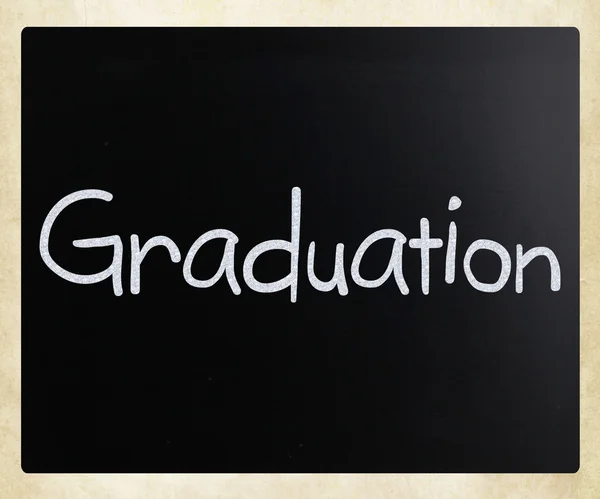 The word "Graduation" handwritten with white chalk on a blackboa — Stock Photo, Image