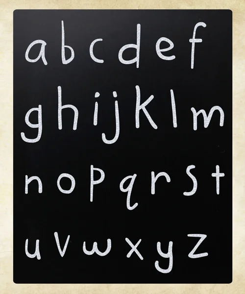 Complete english alphabet handwritten with white chalk on a blac — Stock Photo, Image