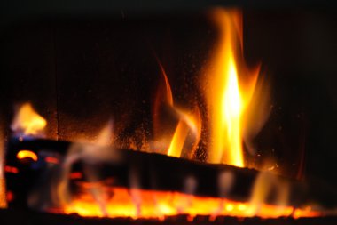 Wood log in a fire place clipart