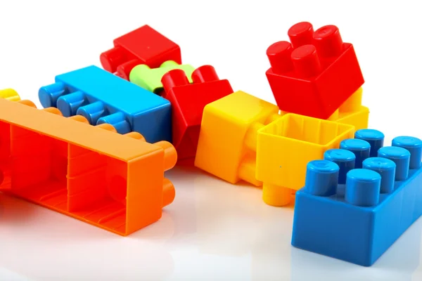 Colored toy bricks on white background — Stock Photo © 3d_kot #9430495