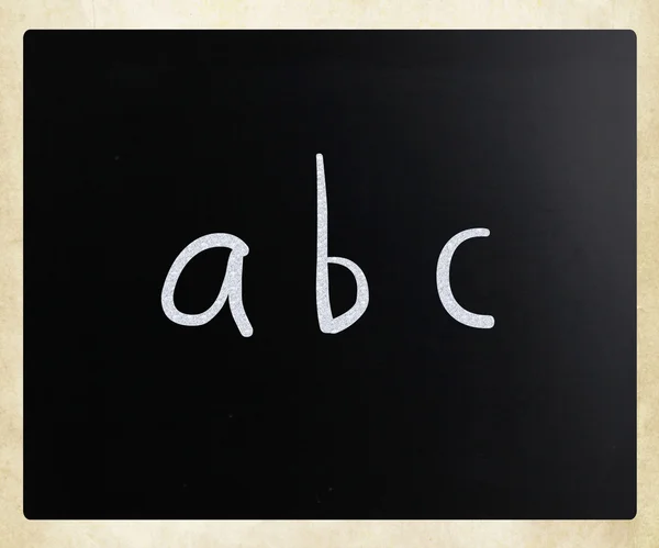 "ABC "handwritten with white chalk on a blackboard — стоковое фото