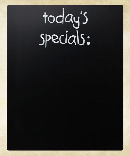 "Dnešní speciality "psané bílou křídou na tabuli — Stock fotografie
