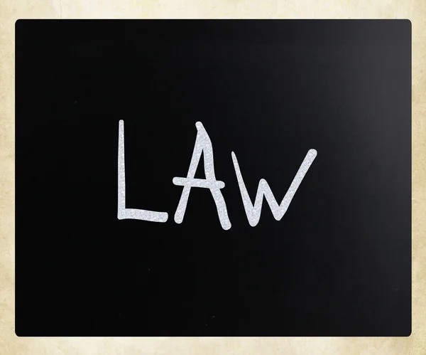 The word "Law" handwritten with white chalk on a blackboard — Stock Photo, Image