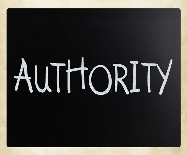 "Authority" handwritten with white chalk on a blackboard — Stock Photo, Image