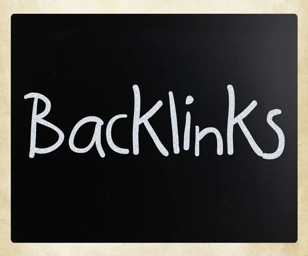"Backlinks" handwritten with white chalk on a blackboard — Stock Photo, Image