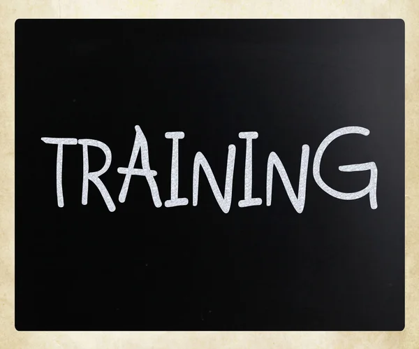 "Training "handwritten with white chalk on a blackboard — стоковое фото