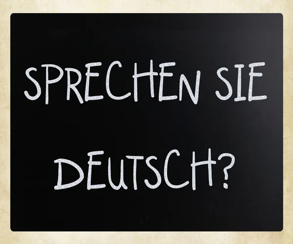 "Sprechen SIE Deutsch? "handskriven med vit krita på en låginkomst — Stockfoto