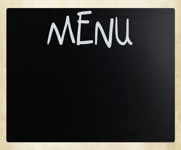 Ordet "meny" handskrivna med vit krita på en svart tavla — Stockfoto