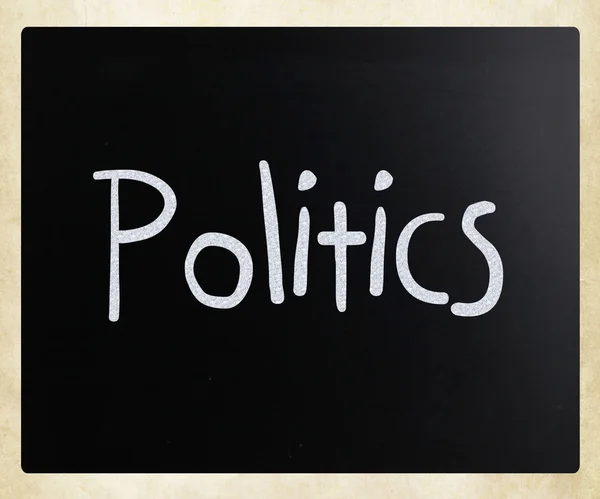 The word "Politics" handwritten with white chalk on a blackboard — Stock Photo, Image