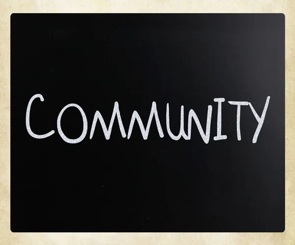 "Communauté "écrit à la main avec de la craie blanche sur un tableau — Photo