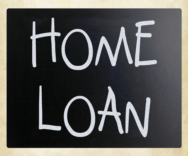 "Home loan "handwritten with white chalk on a blackboard — стоковое фото
