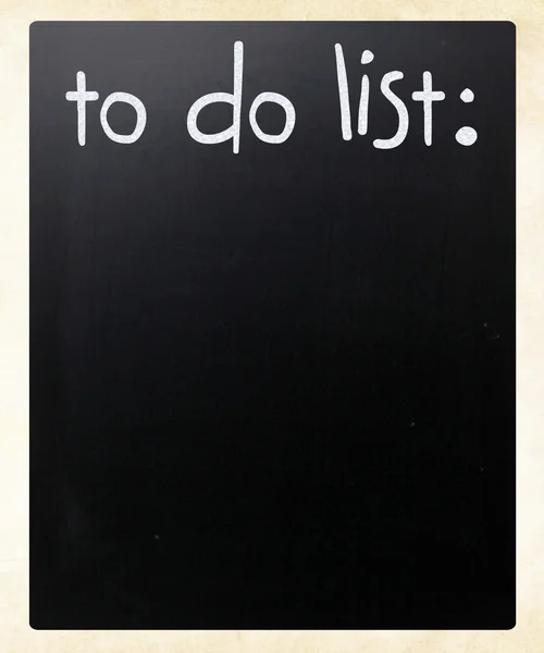 "Faire la liste "écrit à la main avec de la craie blanche sur un tableau noir — Photo