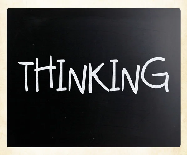 "Thinking" handwritten with white chalk on a blackboard — Stock Photo, Image