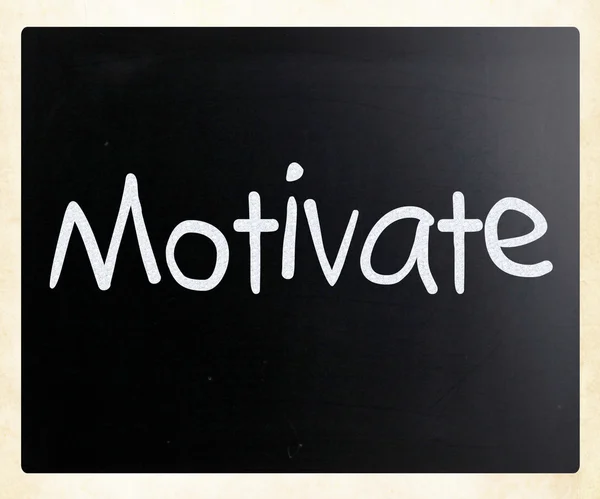 "Motivate" handwritten with white chalk on a blackboard — Stock Photo, Image