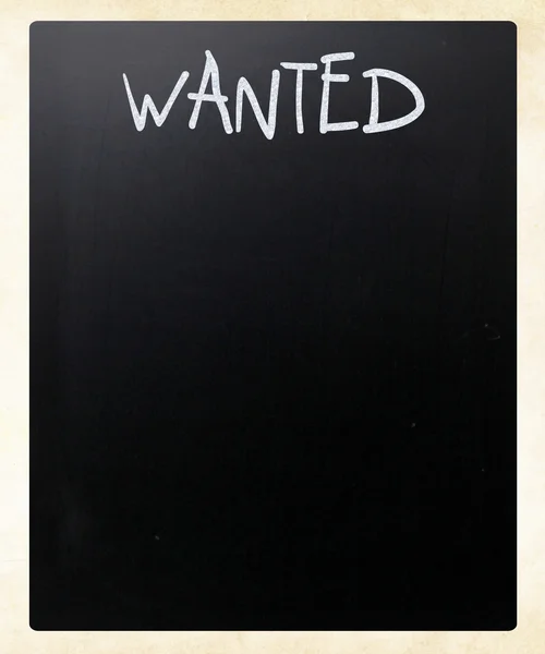 "Wanted" handwritten with white chalk on a blackboard — Stock Photo, Image
