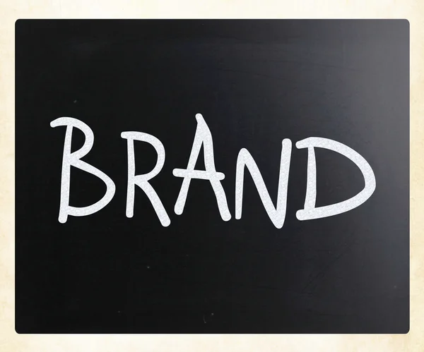 "Brand" handwritten with white chalk on a blackboard — Stock Photo, Image