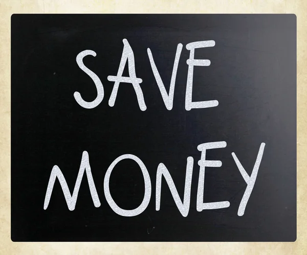 "Save money "handwritten with white chalk on a blackboard — стоковое фото