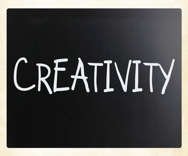 The word "Creativity" handwritten with white chalk on a blackboa — Stock Photo, Image